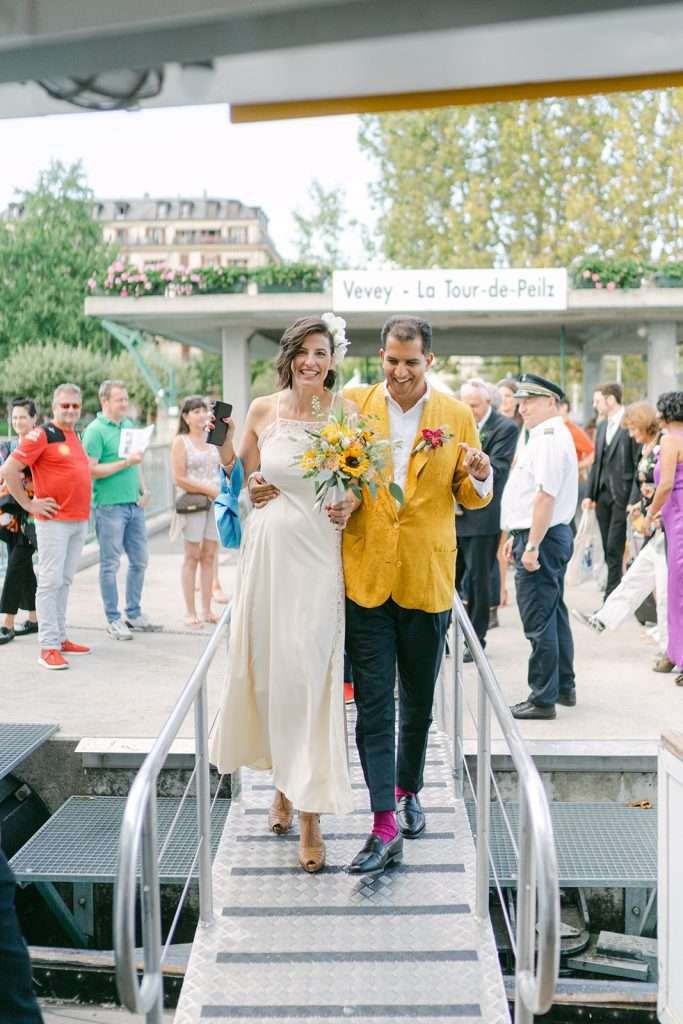 A couple who just got married, going on a boat in Vevey.