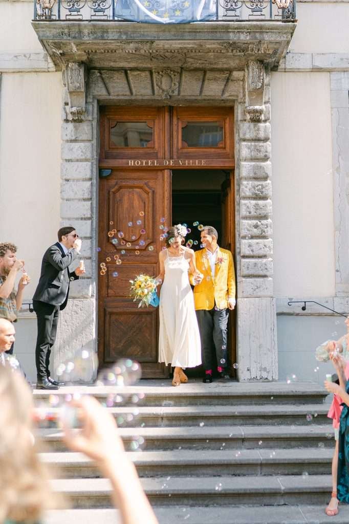 A bride and groom leaving their civil wedding ceremony.