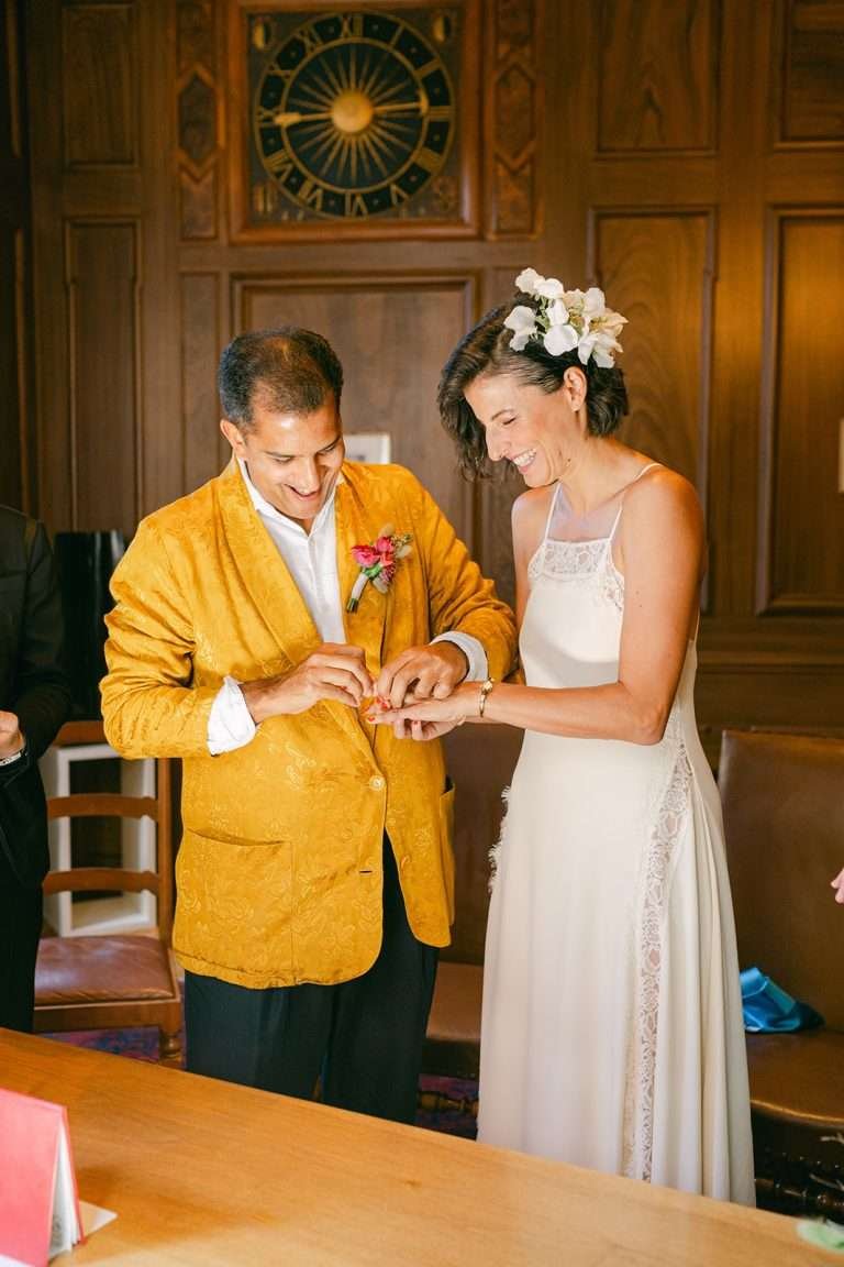 A bride and groom exchanging rings during their civil wedding ceremony.