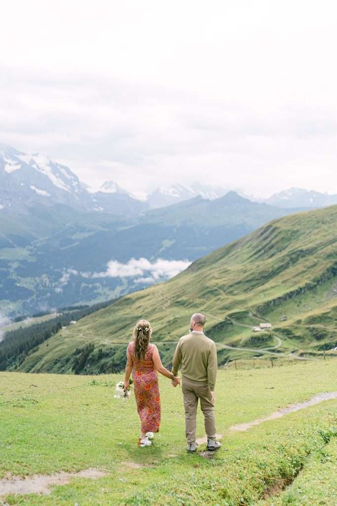 A couple during their engagement shoot in the mountains in Grindelwald Switzerland
