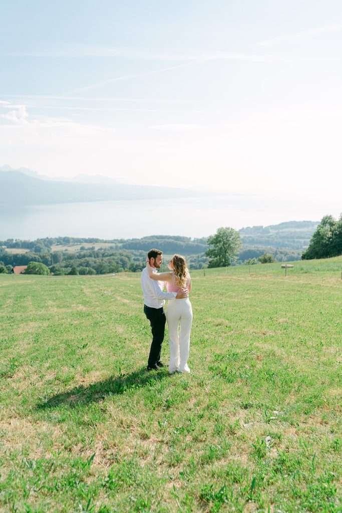 A couple kissing each other during their engagement shoot in Lavaux Switzerland.
