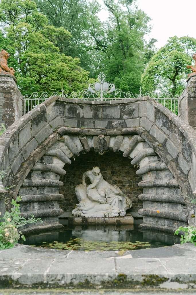 Details of a sculpture inside a fountain and pond