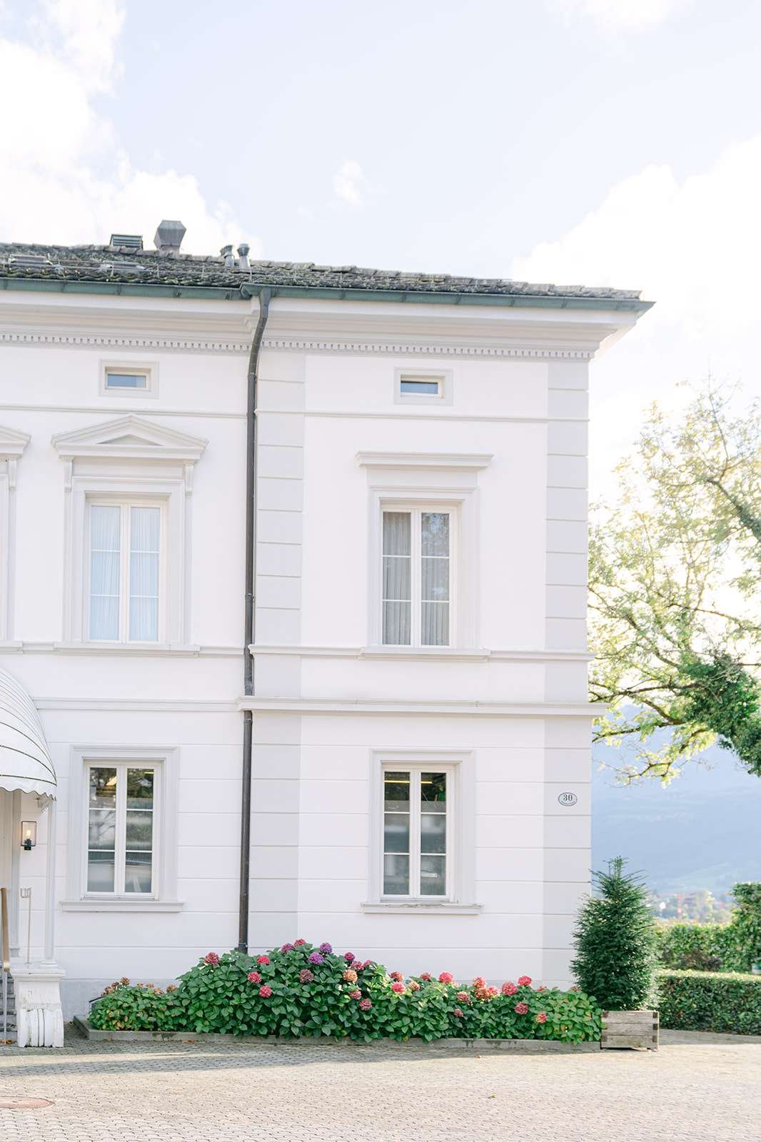 An image captured of the sun behind the beautiful wedding venue